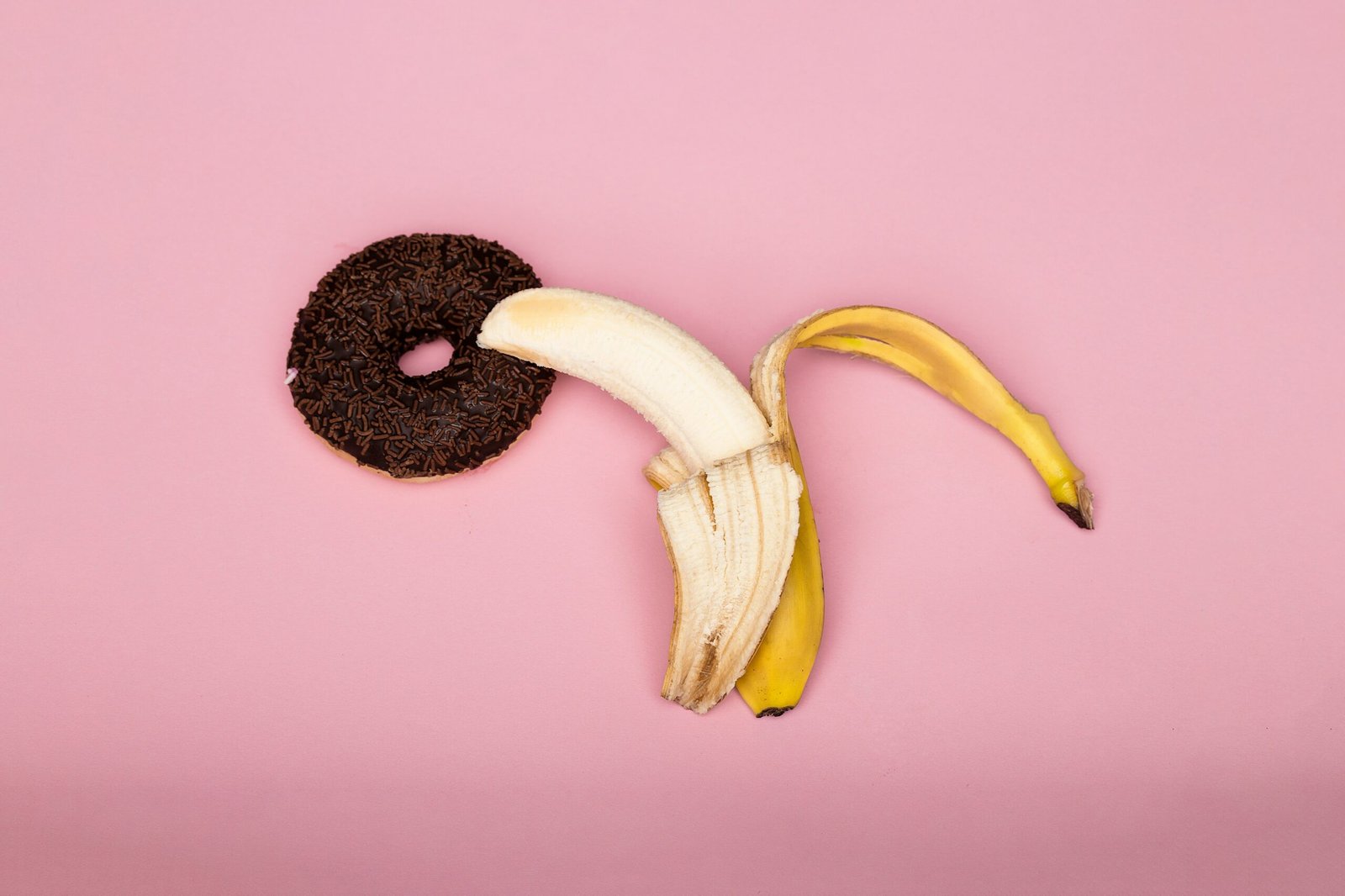 yellow banana fruit on purple surface